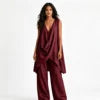 Conjunto de mujer de 2 piezas de estilo bohemio y casual, compuesto por un top de mezcla de lino con escote drapeado y bajo asimétrico, y pantalón largo de pierna ancha. Diseño holgado, cómodo y transpirable, de Sehe Fash