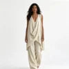 Conjunto de mujer de 2 piezas de estilo bohemio y casual, compuesto por un top de mezcla de lino con escote drapeado y bajo asimétrico, y pantalón largo de pierna ancha. Diseño holgado, cómodo y transpirable, de Sehe Fash