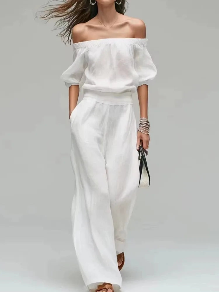 Conjunto de 2 piezas de verano: top de un solo hombro con cintura ajustada y pantalón de pierna ancha. Diseño elegante y moderno en color liso, ideal para looks casuales, vacaciones y fiestas.