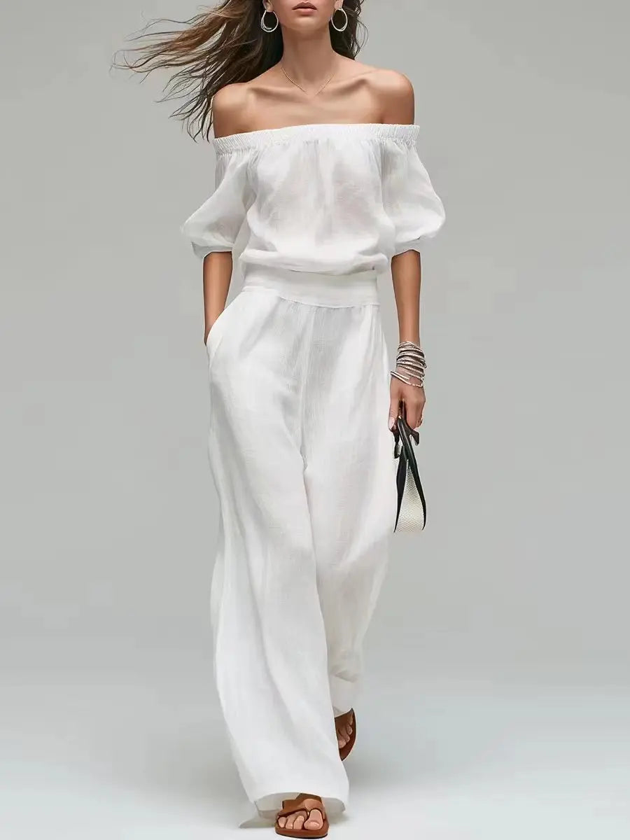Conjunto de 2 piezas de verano: top de un solo hombro con cintura ajustada y pantalón de pierna ancha. Diseño elegante y moderno en color liso, ideal para looks casuales, vacaciones y fiestas.