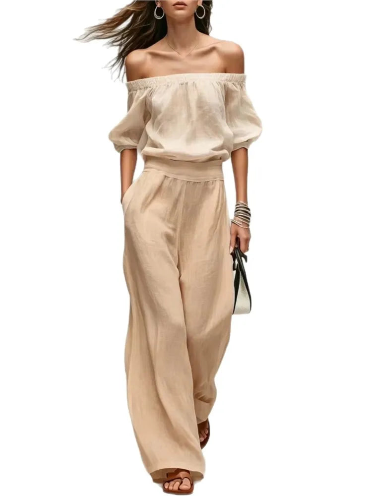Conjunto de 2 piezas de verano: top de un solo hombro con cintura ajustada y pantalón de pierna ancha. Diseño elegante y moderno en color liso, ideal para looks casuales, vacaciones y fiestas.