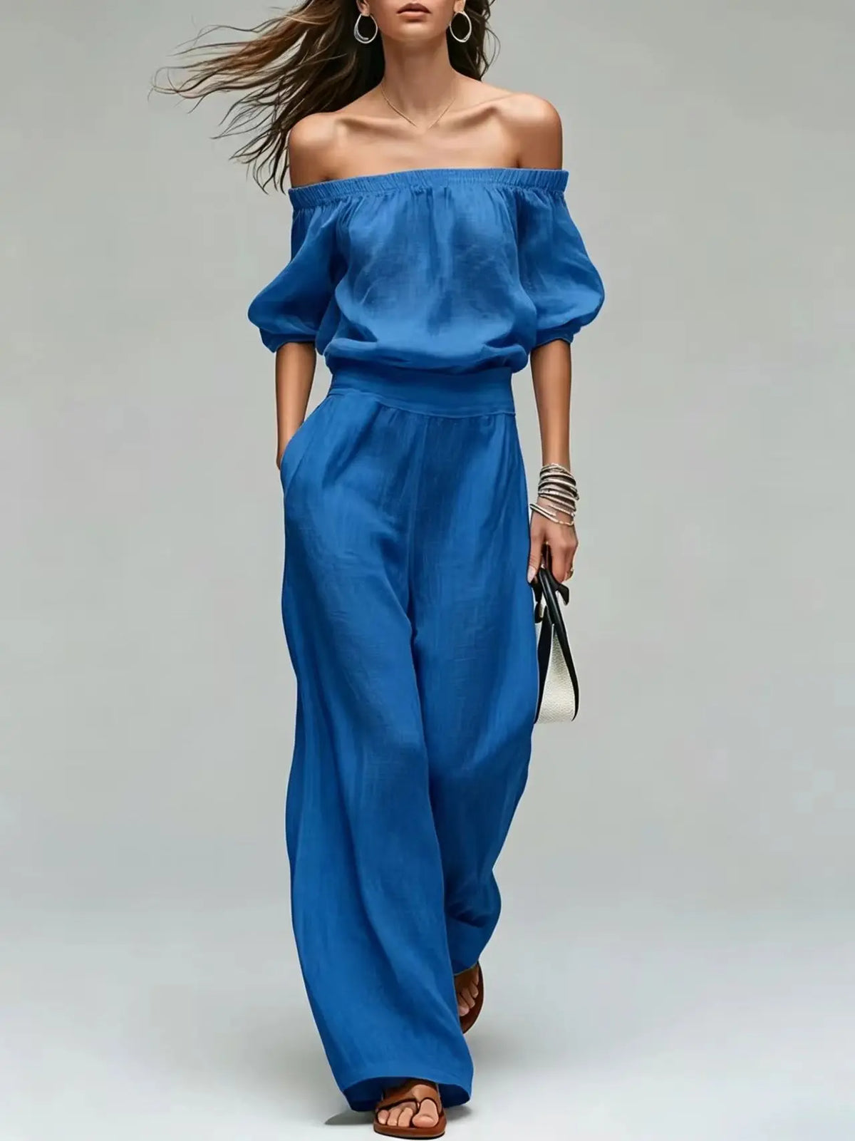 Conjunto de 2 piezas de verano: top de un solo hombro con cintura ajustada y pantalón de pierna ancha. Diseño elegante y moderno en color liso, ideal para looks casuales, vacaciones y fiestas.